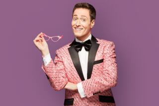 Randy Rainbow with pink glasses.
