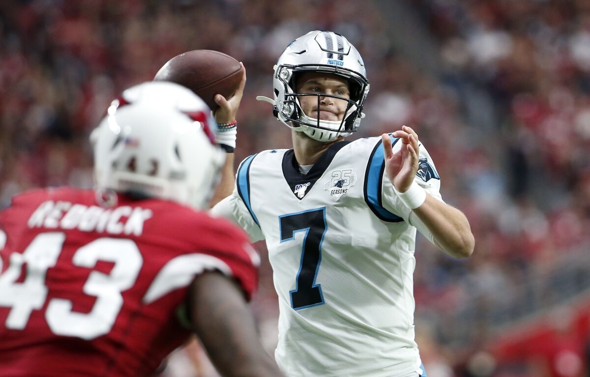 Panthers quarterback Kyle Allen throws a touchdown pass to Greg Olsen during the first half against the Arizona Cardinals on Sunday.