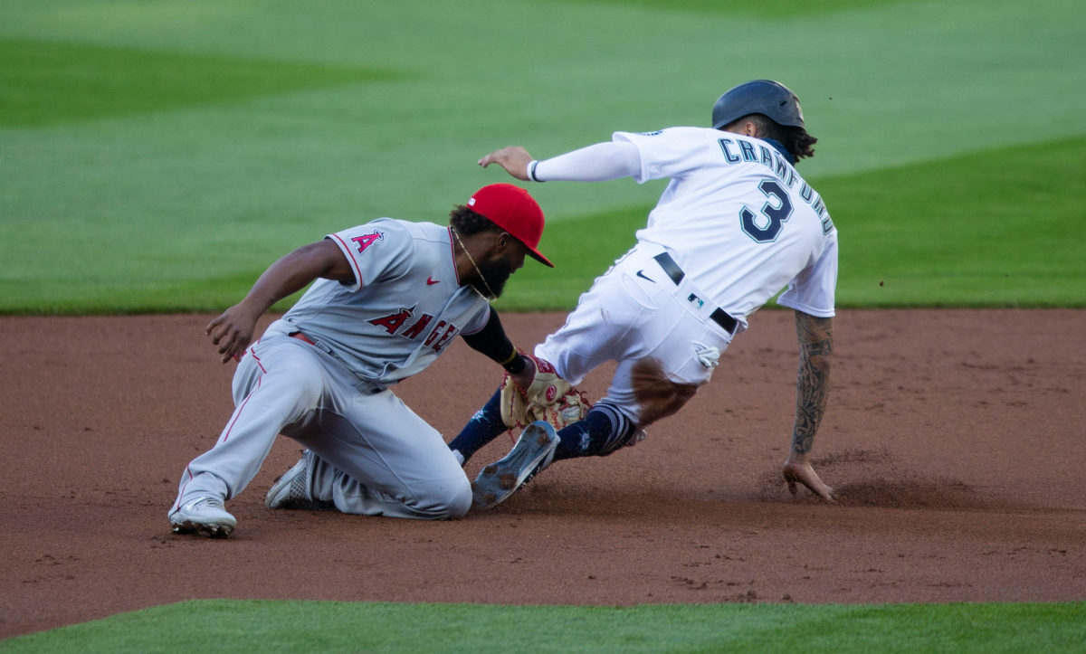 Seattle's J.P. Crawford beats the tag of Angels shortstop Luis Rengifo to steal second base.