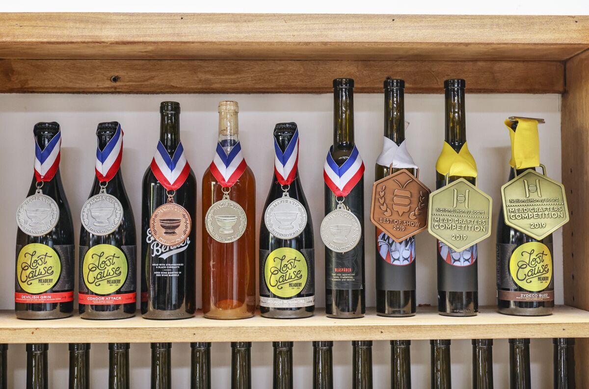 A display of awards for mead excellence at Lost Cause Meadery in San Diego.