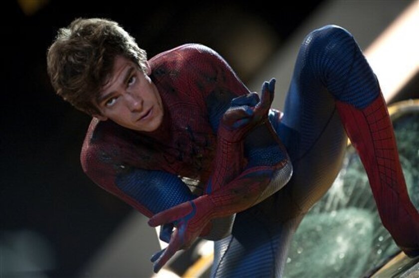 In this film image released by Sony Pictures, Andrew Garfield is shown in a scene from "The Amazing Spider-Man, set for release on July 3, 2012. "The Amazing Spider-Man" pulled in $7.5 million from its debut screenings just after midnight Tuesday, July 3. (AP Photo/Columbia - Sony Pictures, Jaimie Trueblood)