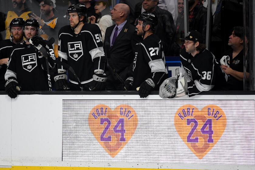 LOS ANGELES, CALIFORNIA - JANUARY 29: The Los Angeles Kings bench look to the ice, behind a Kobe Bryant and Gigi tribute on the boards, during a 4-2 Tampa Bay Lightning win at Staples Center on January 29, 2020 in Los Angeles, California. (Photo by Harry How/Getty Images) ** OUTS - ELSENT, FPG, CM - OUTS * NM, PH, VA if sourced by CT, LA or MoD **