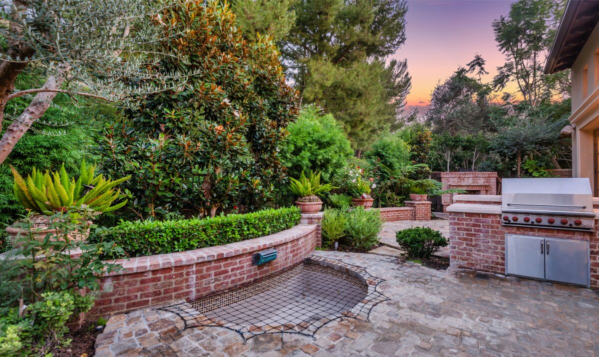 An outdoor grill area with brick detailing