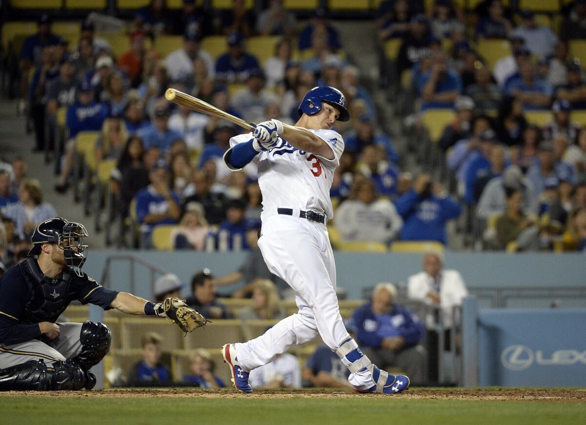 Dodgers center fielder Joc Pederson, breaking up Brewers starter Jimmy Nelson's no-hitter in the sixth inning, drove in the winning run with a double in the seventh inning Friday night.