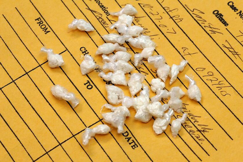 Doses of crack cocaine, confiscated and being held as evidence, are seen on an envelope at the Aliquippa, Pa. Police Department on Tuesday, Jan. 15, 2008. In Rust Belt cities like Aliquippa, drugs moved in after steel moved out. Aliquippa was once a steelmaking powerhouse about 30 miles from Pittsburgh. Aliquippa's population is now down to 11,000, half of what it was in 1970, and law enforcement officials estimate drug dealers did $30 million in business in Beaver County in 2006, with this woeful city at the center of the trade. (AP Photo/Gene J. Puskar)