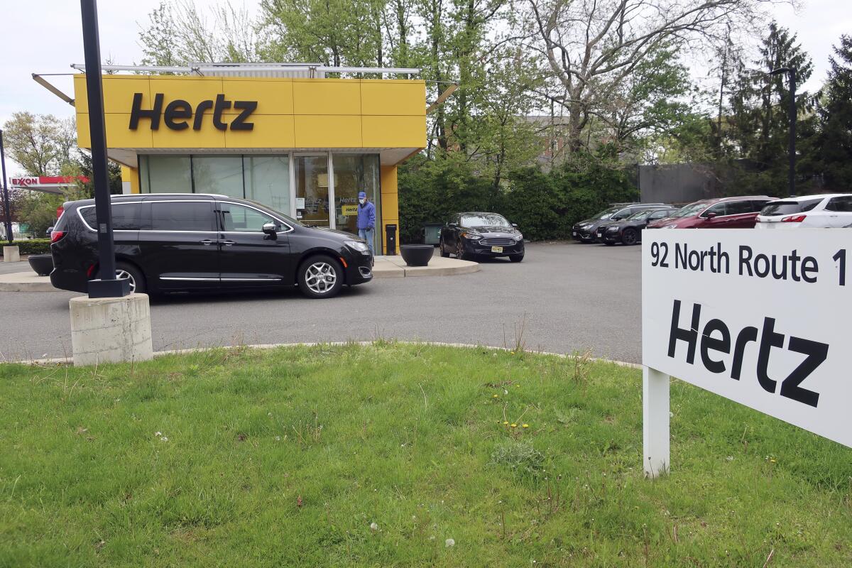 FILE - In this May 6, 2020, file photo, a Hertz car rental is closed during the coronavirus pandemic in Paramus, N.J. Two investment firms are looking to take at least a controlling stake in rental car company Hertz for up to $4.2 billion and help it emerge from bankruptcy protection. Hertz Global Holdings Inc. said Tuesday, March 2, 2021 that Knighthead Capital Management and Certares Opportunities will have the chance to buy the entire reorganized business, but no less than a majority of its shares. (AP Photo/Ted Shaffrey, File)