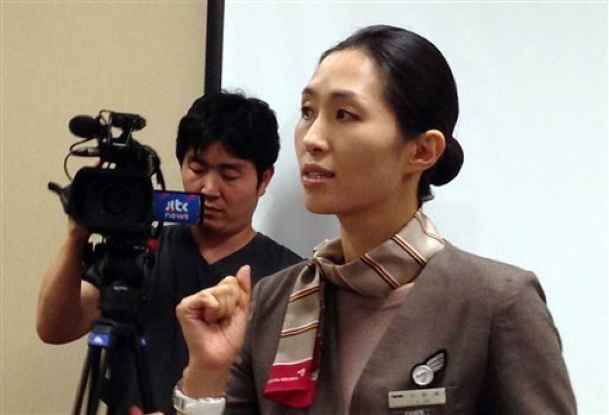 Asiana Airlines Flight 214 flight attendant and cabin manager, lee yoon Hye, speaks to the media during a news conference in San Francisco, Sunday, July 7, 2013. Flight 214 crashed on landing at San Francisco International Airport on Saturday, killing two people and injuring dozens. Lee was describing her experience to members of the media. (AP Photo/Jack Chang)