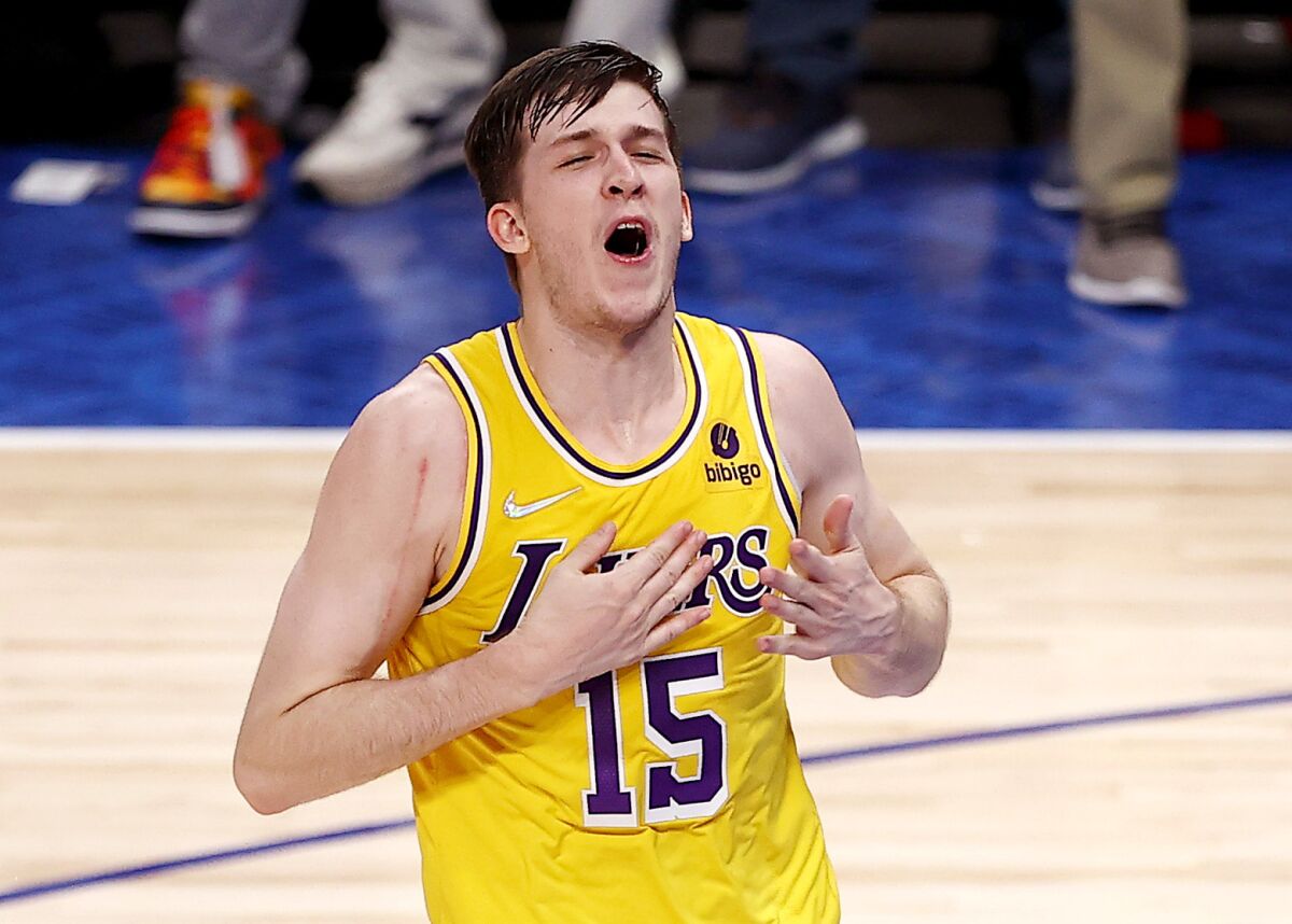Lakers guard Austin Reaves reacts after making a game-winning shot in Dallas.