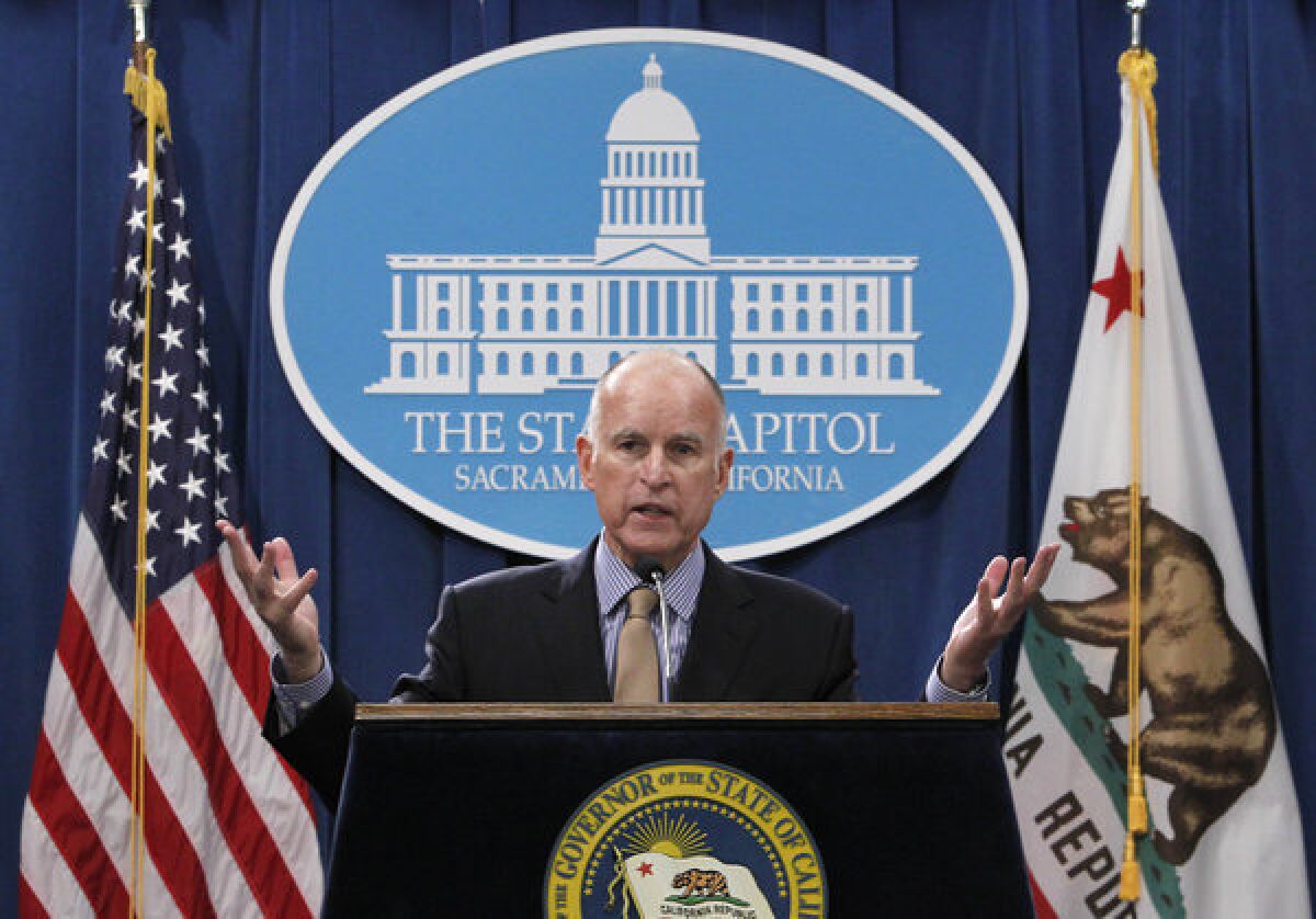 Gov. Jerry Brown responds to a question concerning his revised 2013-14 state budget plan during a news conference at the Capitol in Sacramento, Calif., Tuesday.
