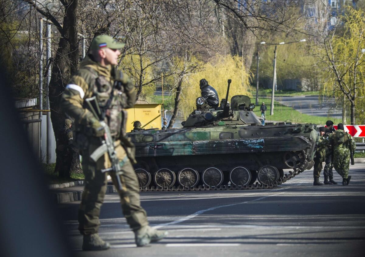 Pro-Russia separatist soldiers man a checkpoint near Donetsk, in eastern Ukraine, on April 23. Fighting and heavy artillery exchanges with Ukrainian forces have resumed with the onset of spring weather.