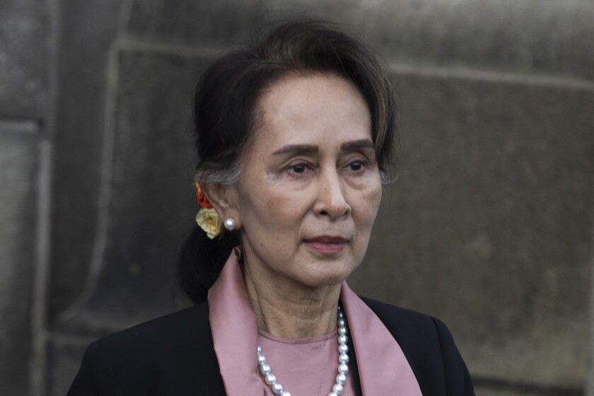 FILE - Myanmar's leader Aung San Suu Kyi leaves the International Court of Justice after the first day of three days of hearings in The Hague, Netherlands, on Dec. 10, 2019. A court in Myanmar on Monday, Jan. 10, 2022, sentenced the country's ousted leader, Aung San Suu Kyi to 4 more years’ imprisonment after finding her guilty of illegally importing and possessing walkie-talkies and violating coronavirus restrictions,a legal official acquainted with the cases said. (AP Photo/Peter Dejong, File)