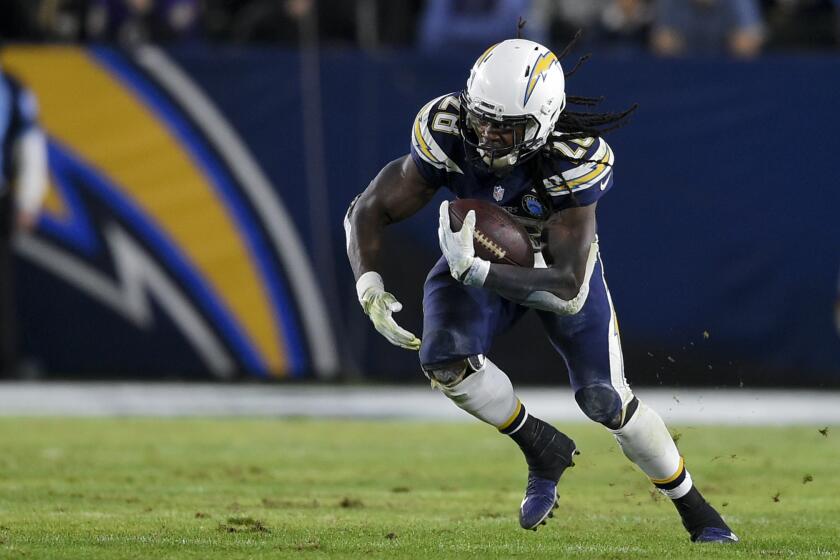Los Angeles Chargers running back Melvin Gordon runs the ball during the second half of an NFL football game against the Baltimore Ravens in Carson, Calif., Sunday, Dec. 23, 2018. (AP Photo/Kelvin Kuo)