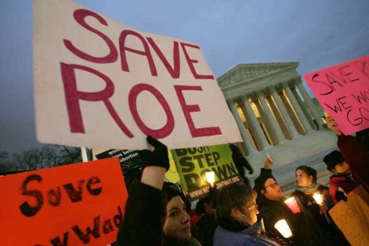 The U.S. Supreme Court will soon consider a handful of cases on controversial issues, including abortion. Above, pro-choice supporters hold a candlelight vigil in front of the Supreme Court building in 2005.