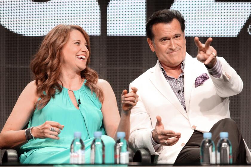 Lucy Lawless and Bruce Campbell during the "Ash vs. Evil Dead" panel at Starz's TCA presentation.