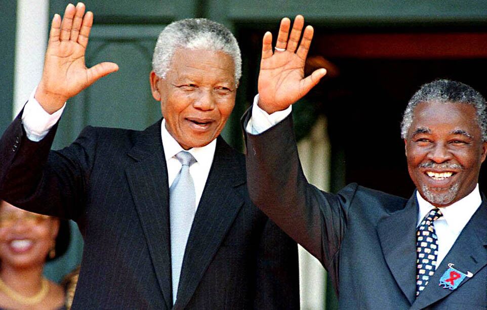 South African President Nelson Mandela and Deputy President Thabo Mbeki wave to well-wishers after Mandela's last major address to Parliament on Feb. 5, 1999.