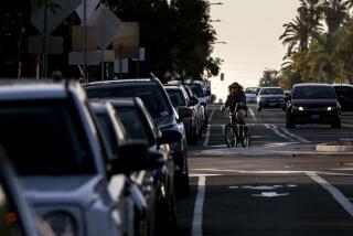 San Diego, CA - December 08: A cyclist rides down Meade Avenue in the Normal Heights neighborhood on Wednesday, Dec. 8, 2021 in San Diego, CA. (Sam Hodgson / The San Diego Union-Tribune)