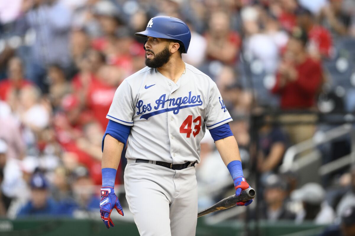 Edwin Ríos walks back to the dugout after an at-bat against the Washington Nationals in May.