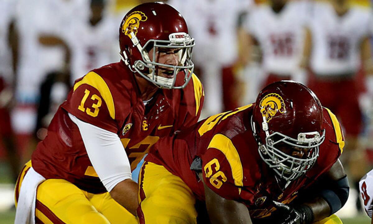USC quarterback Max Wittek takes a snap from center Marcus Martin during a Sept. 7 loss to Washington State. Wittek plans to play at another university next season.