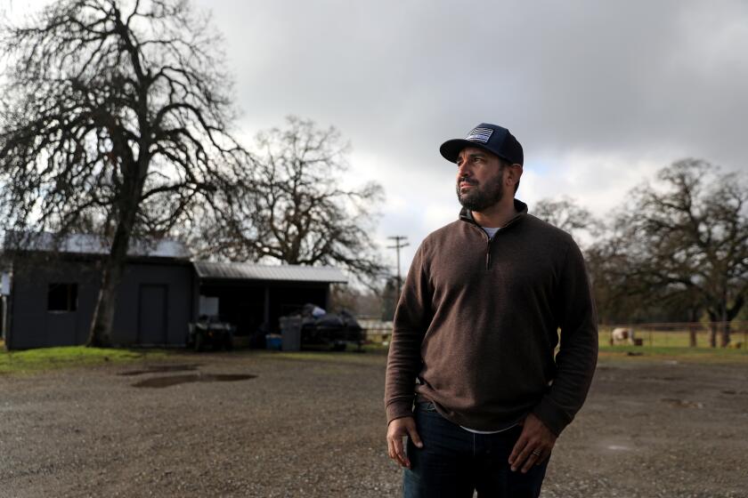 PALO CEDRO, CA - JANUARY 08: Carlos Zapata, 42, a member of the Open Shasta County movement, at his ranch on Friday, Jan. 8, 2021 in Palo Cedro, CA. Zapata supported newly elected Patrick Jones, 52, of Redding, Shasta County Supervisor, District 4, as one of two Shasta County Supervisors who unlocked the doors to the chambers to hold an in-person meeting in that was supposed to be virtual to protest statewide COVID-19 restrictions, in Redding. (Gary Coronado / Los Angeles Times)