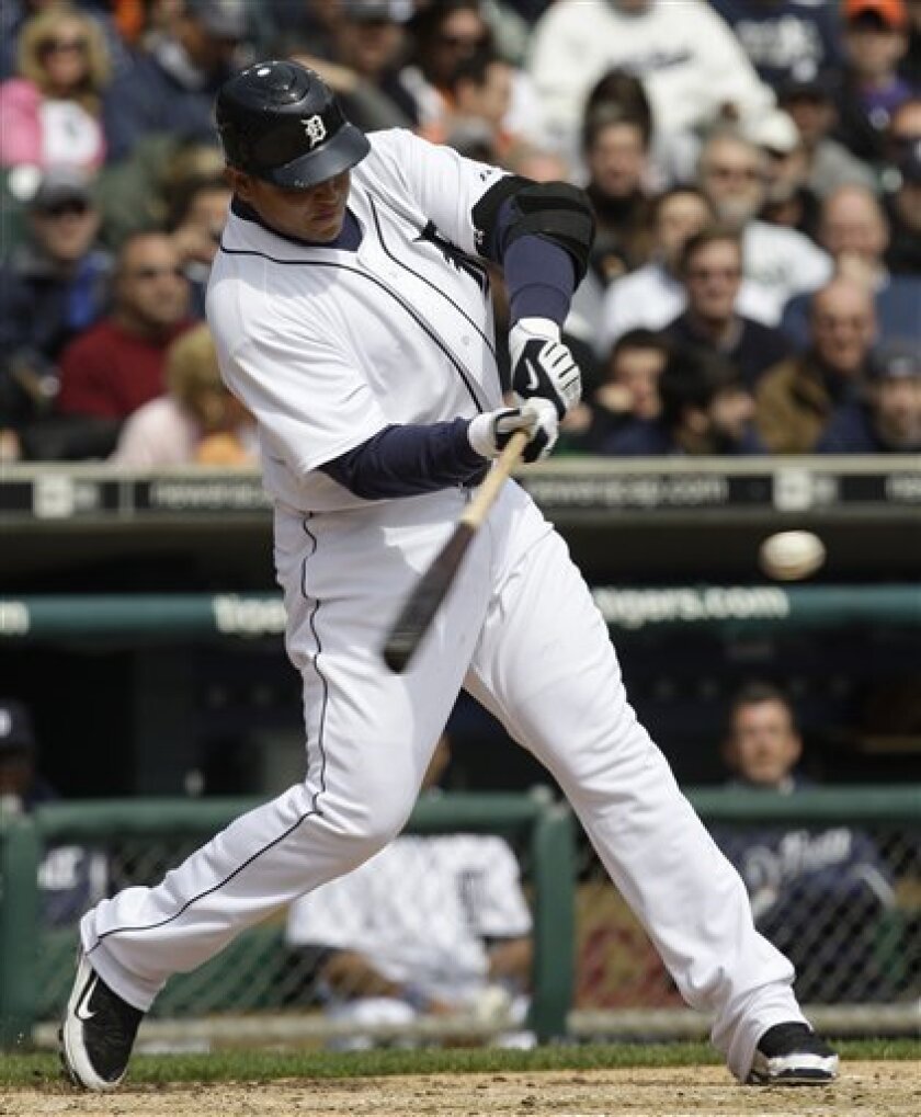 Detroit Tigers Miguel Cabrera hits a grand slam off Texas Rangers pitcher Kris Benson in the fourth inning during a baseball game in Detroit, Friday April 10, 2009. (AP Photo/Paul Sancya)