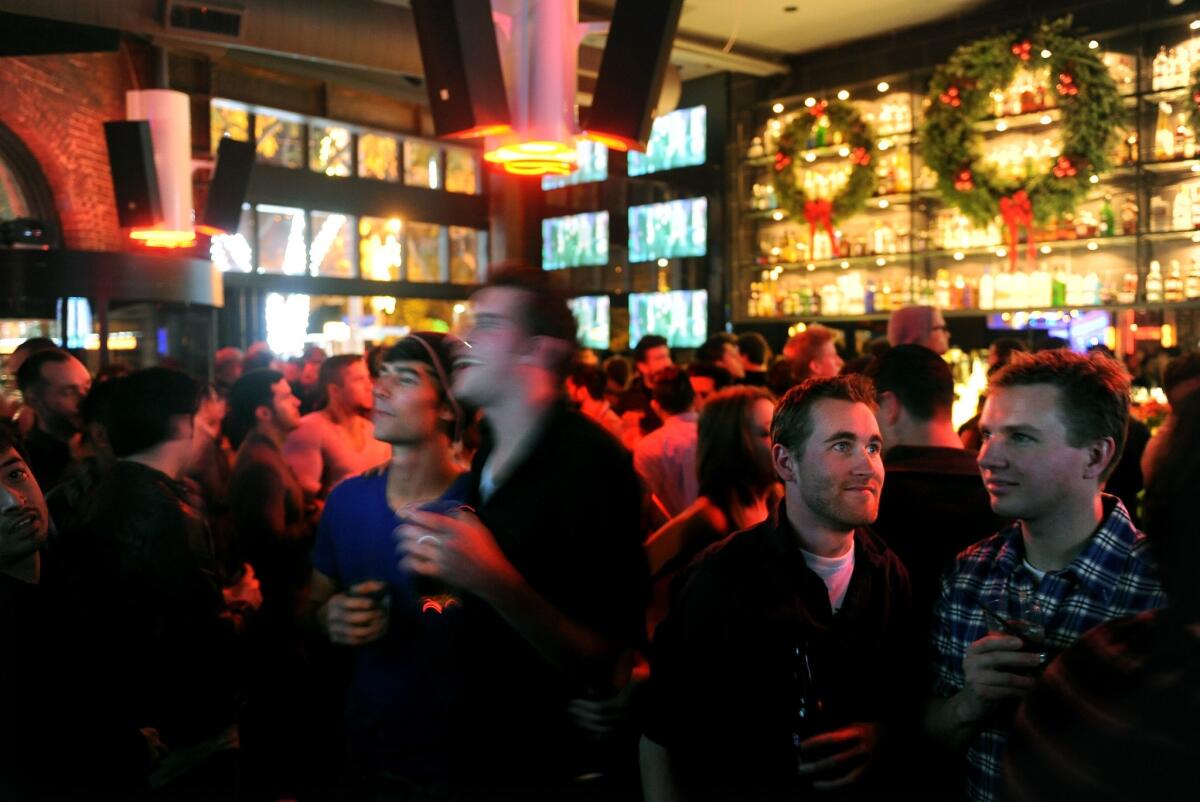 Customers enjoy drinks in 2011 at Revolver, a bar that is joining other West Hollywood businesses to donate money to support gay rights in Russia.