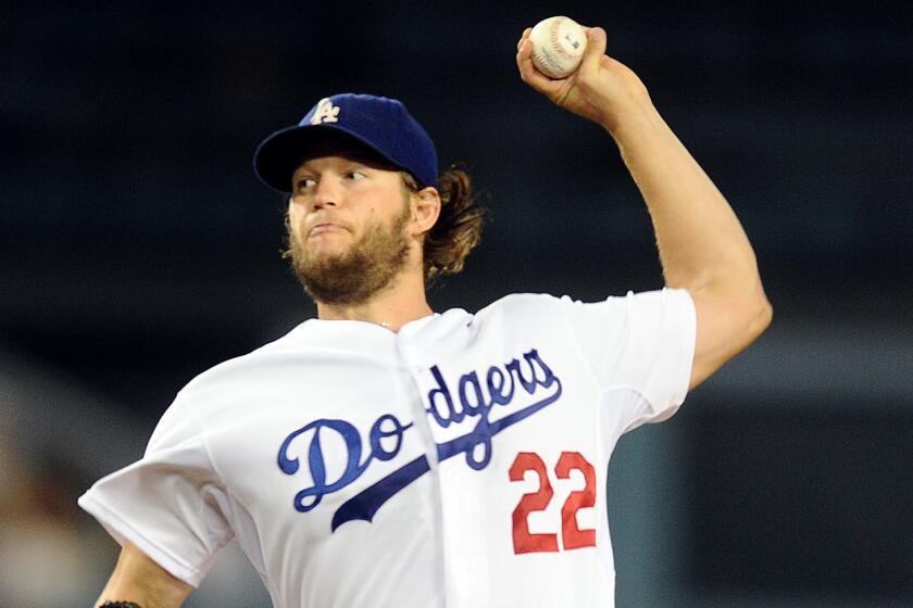 Dodgers starter Clayton Kershaw delivers a pitch during the fourth inning against the San Diego Padres on Monday.