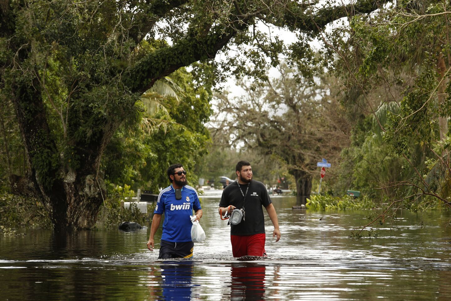 In Bonita Springs, floodwaters reached waist deep in some areas on Monday, flooding homes and cars.