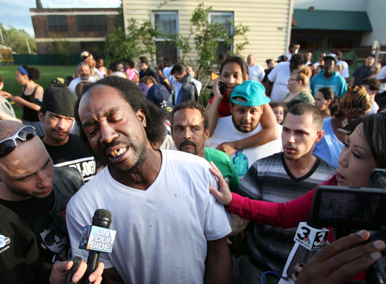 Charles Ramsey speaks to media near a home in the 2200 block of Seymour Avenue, where three women, who were held captive for decades, were rescued in Cleveland.