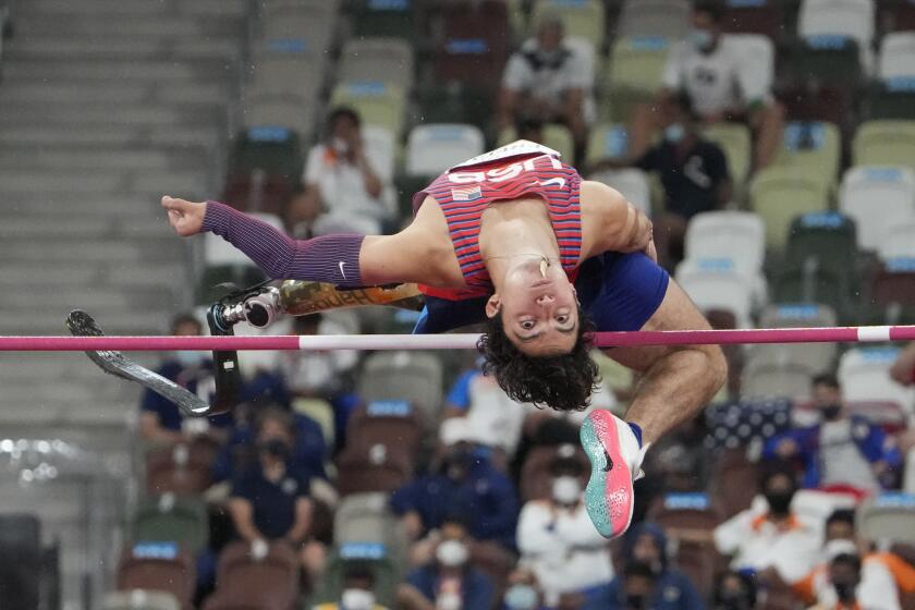 Ezra Frech of the United States competes in the men's high jump T63 final during the Tokyo 2020 Paralympics Games at the National Stadium in Tokyo, Japan, Tuesday, Aug. 31, 2021. (AP Photo/Eugene Hoshiko)