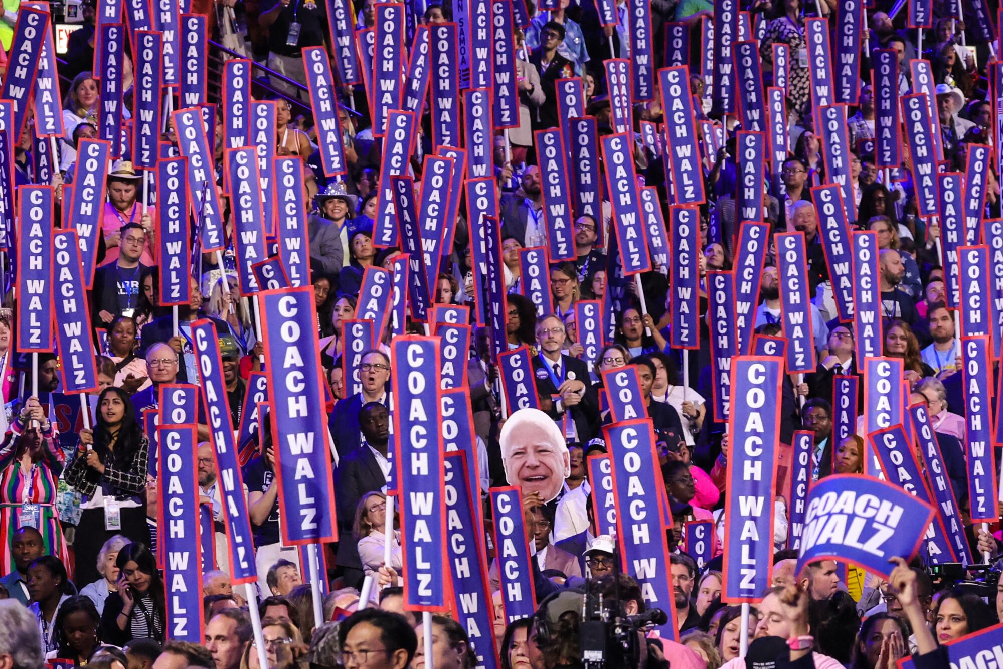 Delegates cheer Minnesota Governor Tim Walz during day three of the Democratic National Convention.