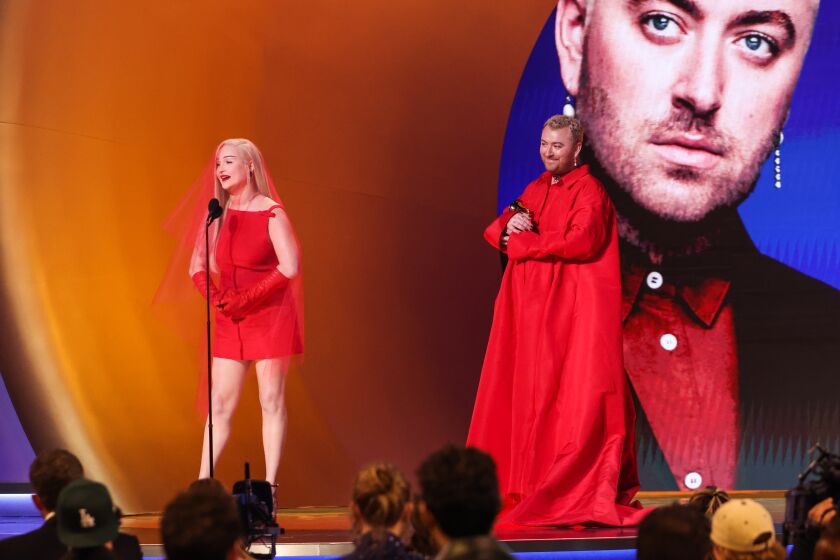 LOS ANGELES, CALIFORNIA - FEBRUARY 5: :(L-R) Kim Petras and Sam Smith accept the Best Pop Duo/Group Performance award for "Unholy" onstage during the 65th GRAMMY Awards at Crypto.com Arena on February 05, 2023 in Los Angeles, California. (Photo by Robert Gauthier / Los Angeles Times)
