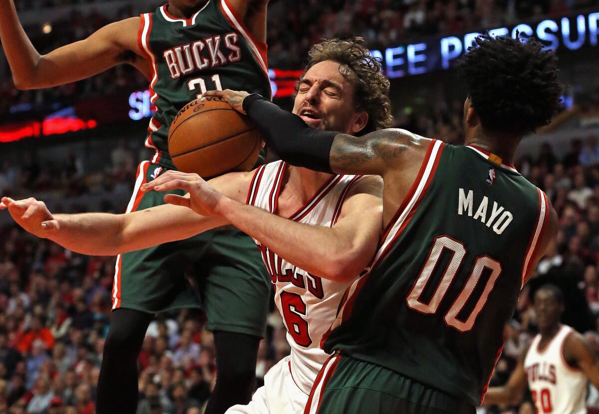 Bulls forward Pau Gasol is fouled by Bucks forward O.J. Mayo. The Bucks beat the Bulls, 94-88.