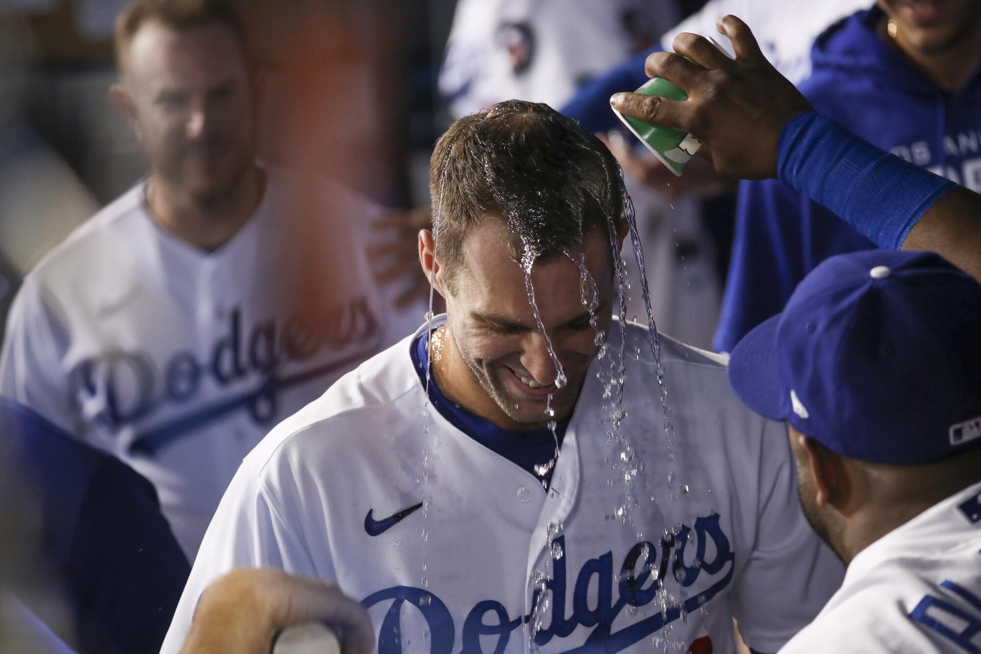 Chris Taylor is rewarded with a drenching after hitting a three-run homer
