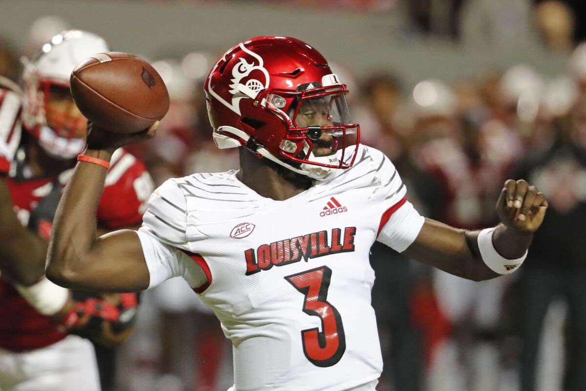 Louisville quarterback Malik Cunningham (3) throws the ball against North Carolina State during the first half of an NCAA college football game in Raleigh, N.C., Saturday, Oct. 30, 2021. (AP Photo/Karl B DeBlaker)