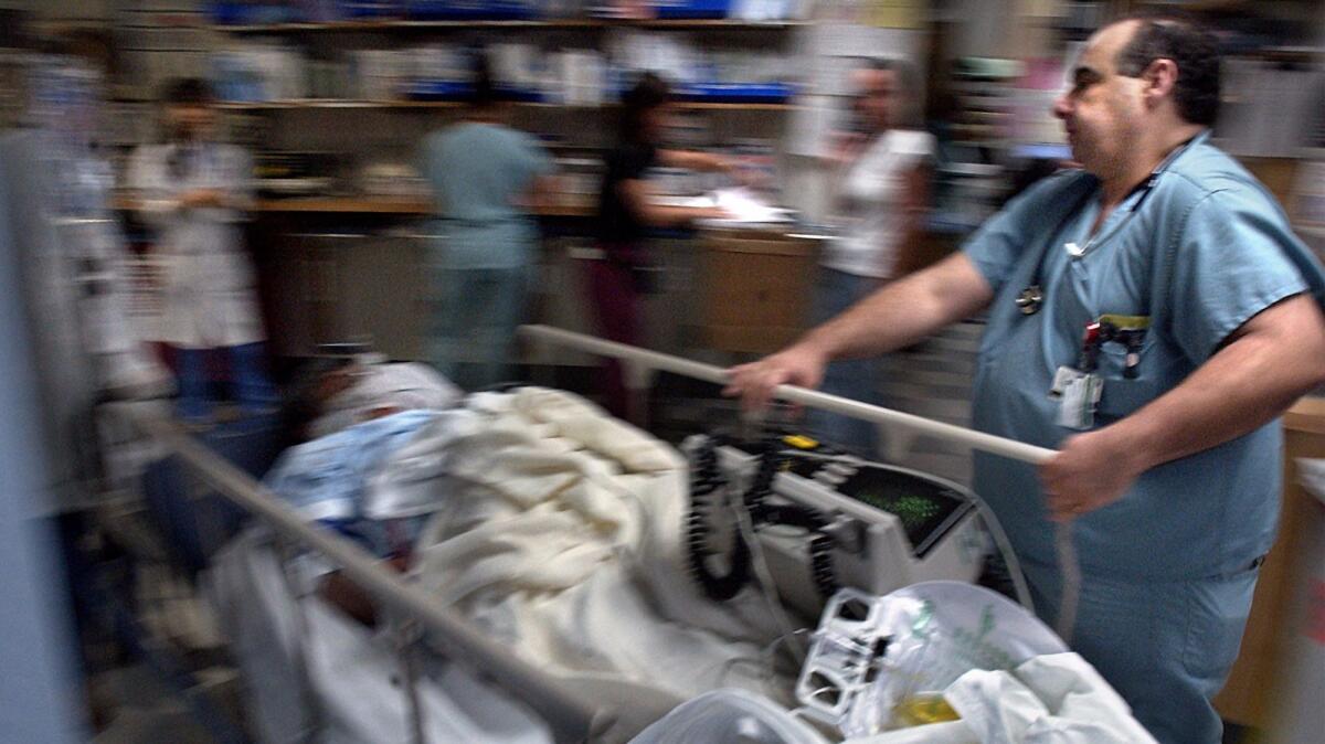 A trauma patient is rushed into the emergency room at Harbor-UCLA Medical Center in 2002. The hospital was among 14 in California fined by the state health department.