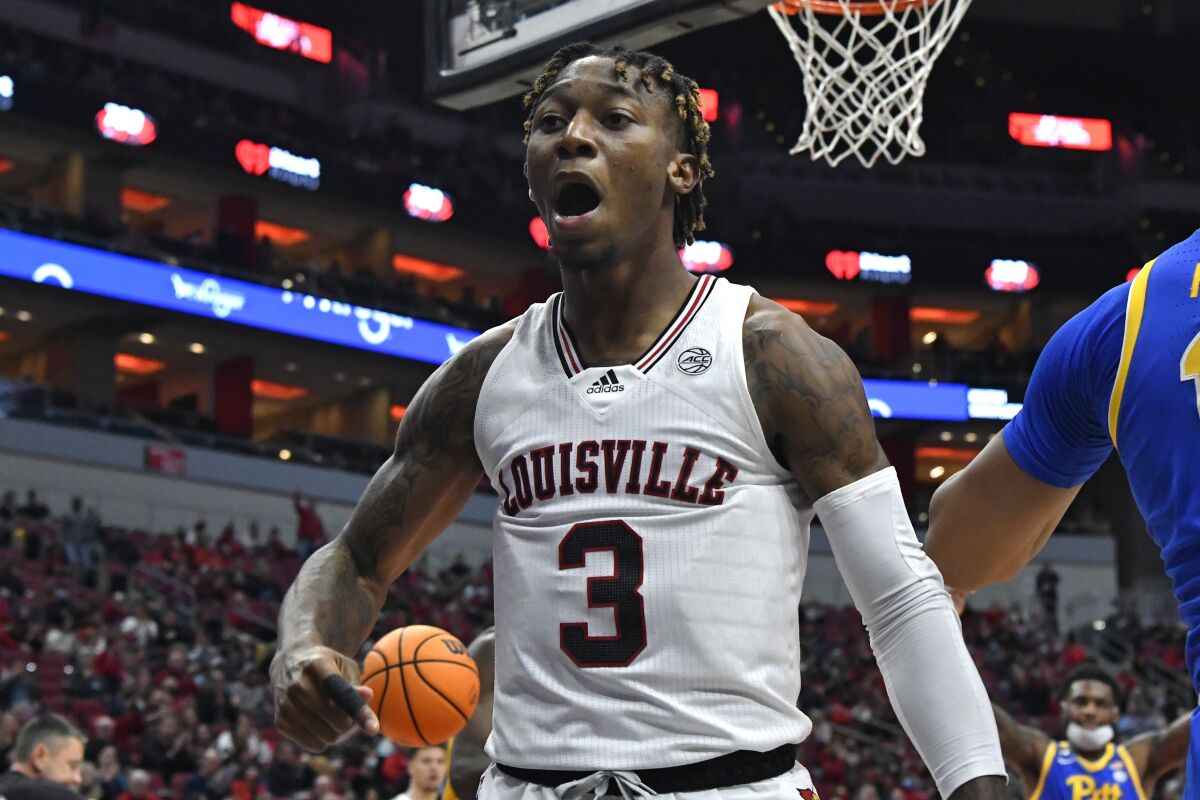 Louisville guard El Ellis (3) reacts after scoring a basket during the second half of an NCAA college basketball game against Pittsburgh in Louisville, Ky., Wednesday, Jan. 5, 2022. Louisville won 75-72. (AP Photo/Timothy D. Easley)