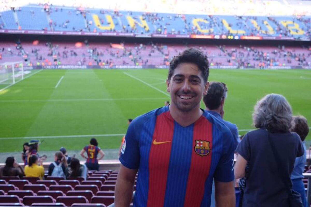 Latinx Files reader Joshua Rivera poses at Barcelona's famed Camp Nou stadium.