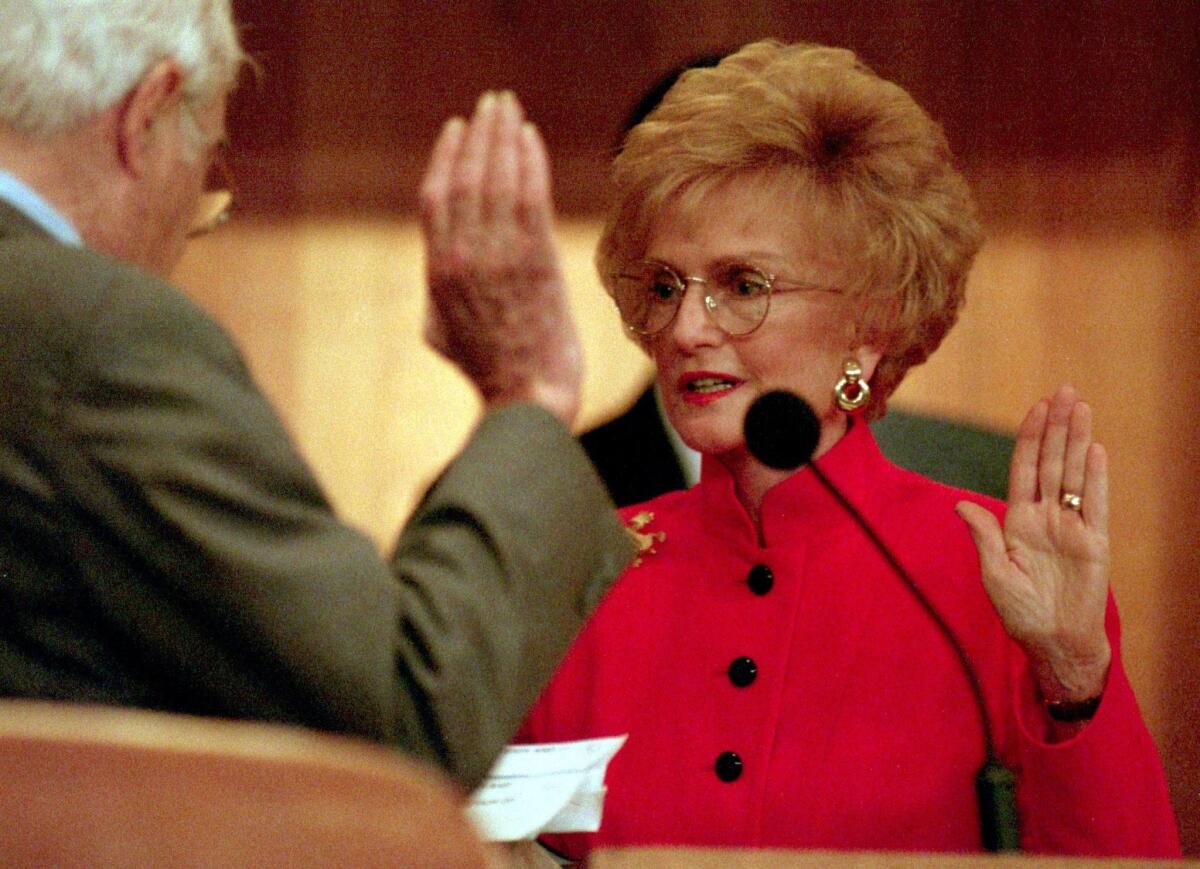 In this Los Angeles Times file photo from 1995, Marian Bergeson is sworn in at the morning Orange County Board of Supervisors meeting.