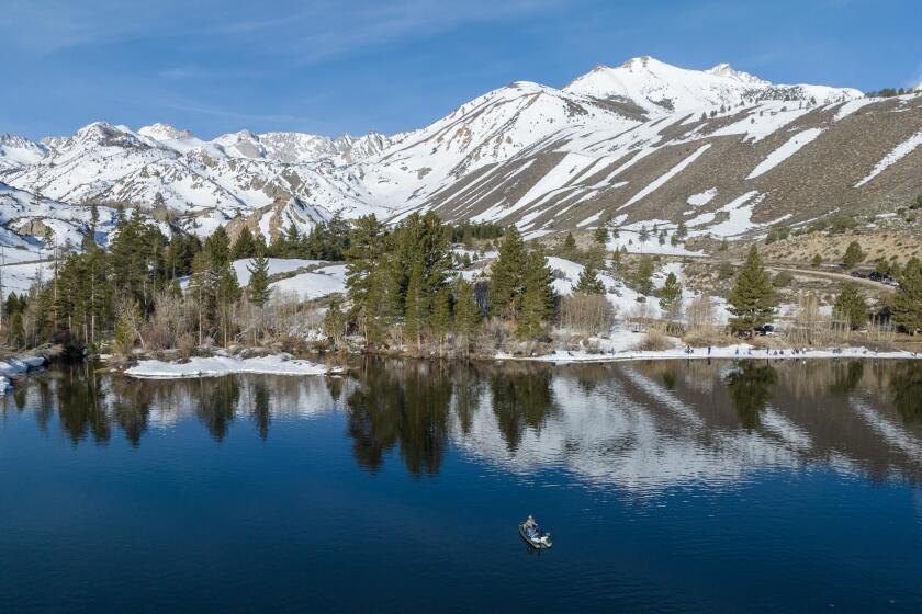Bishop, CA - April 29: The Sierra Nevada crest is reflected on Intake 2 near Aspendell on the official opening day of the Eastern Sierra trout season Saturday, April 29, 2023 in Bishop, CA. (Brian van der Brug / Los Angeles Times)