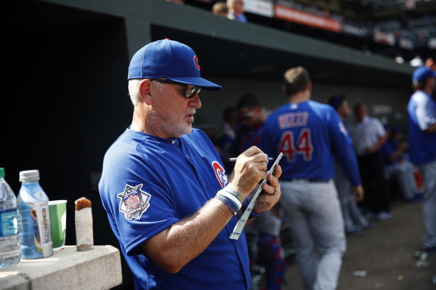 Cubs manager Joe Maddon stands in the dugout during a game against the Orioles in Baltimore on Sunday, July 16, 2017.