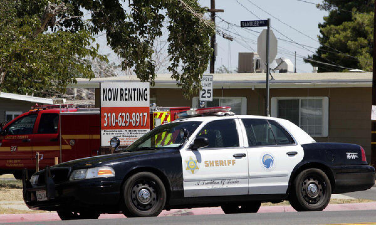 A Los Angeles County sheriff's patrol car sits in a Palmdale neighborhood in 2011.