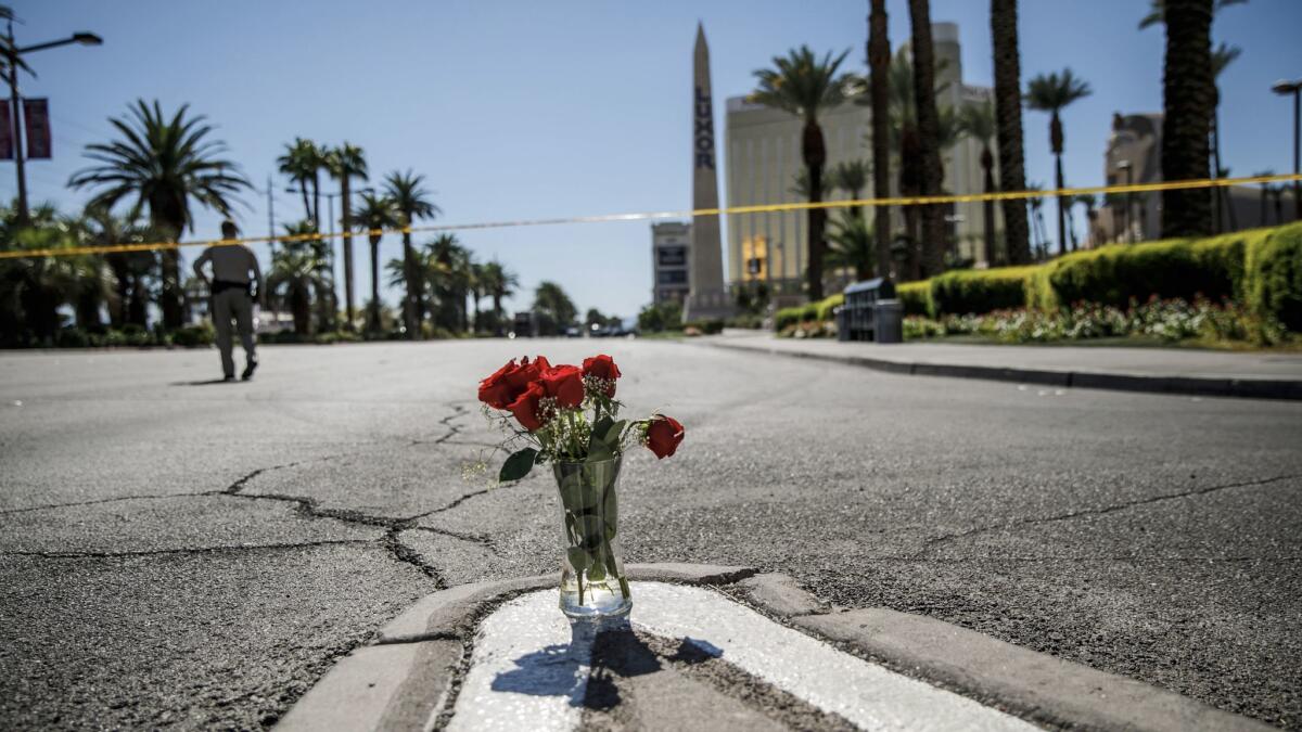 A vase of flowers was left on Las Vegas Boulevard and Reno Avenue Monday morning for the victims of the mass shooting in Las Vegas.