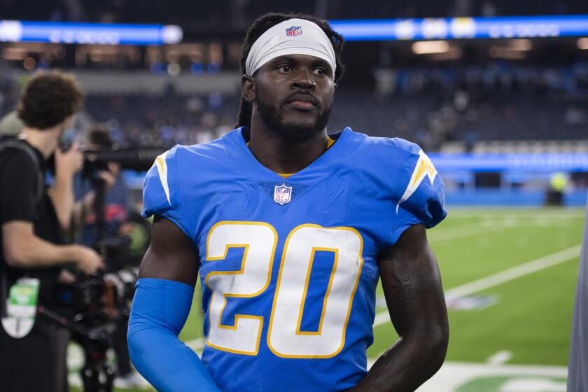 Los Angeles Chargers defensive back Tevaughn Campbell (20) walk back to the locker room after an NFL football game against the Las Vegas Raiders Monday, Oct. 4, 2021, in Inglewood, Calif. (AP Photo/Kyusung Gong)