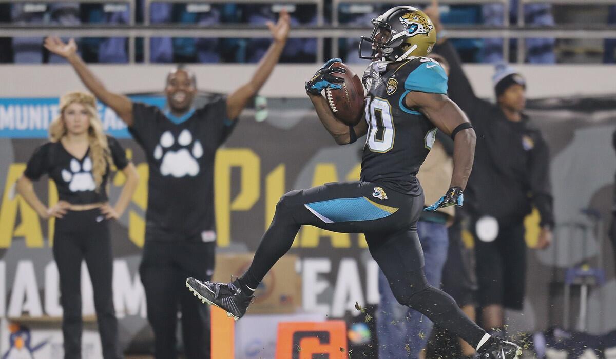 Jacksonville running back Jordan Todman scores on a 62-yard touchdown during a 21-13 win over the Tennessee Titans on Monday.
