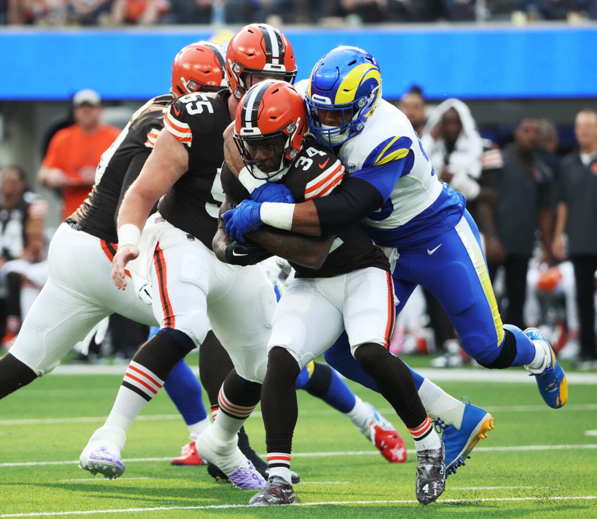 The Rams' Aaron Donald tackles Cleveland Browns back Jerome Ford.
