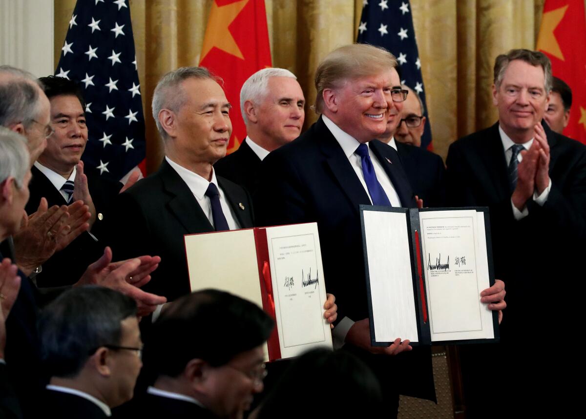 President Trump at the ceremony for the trade deal with China.