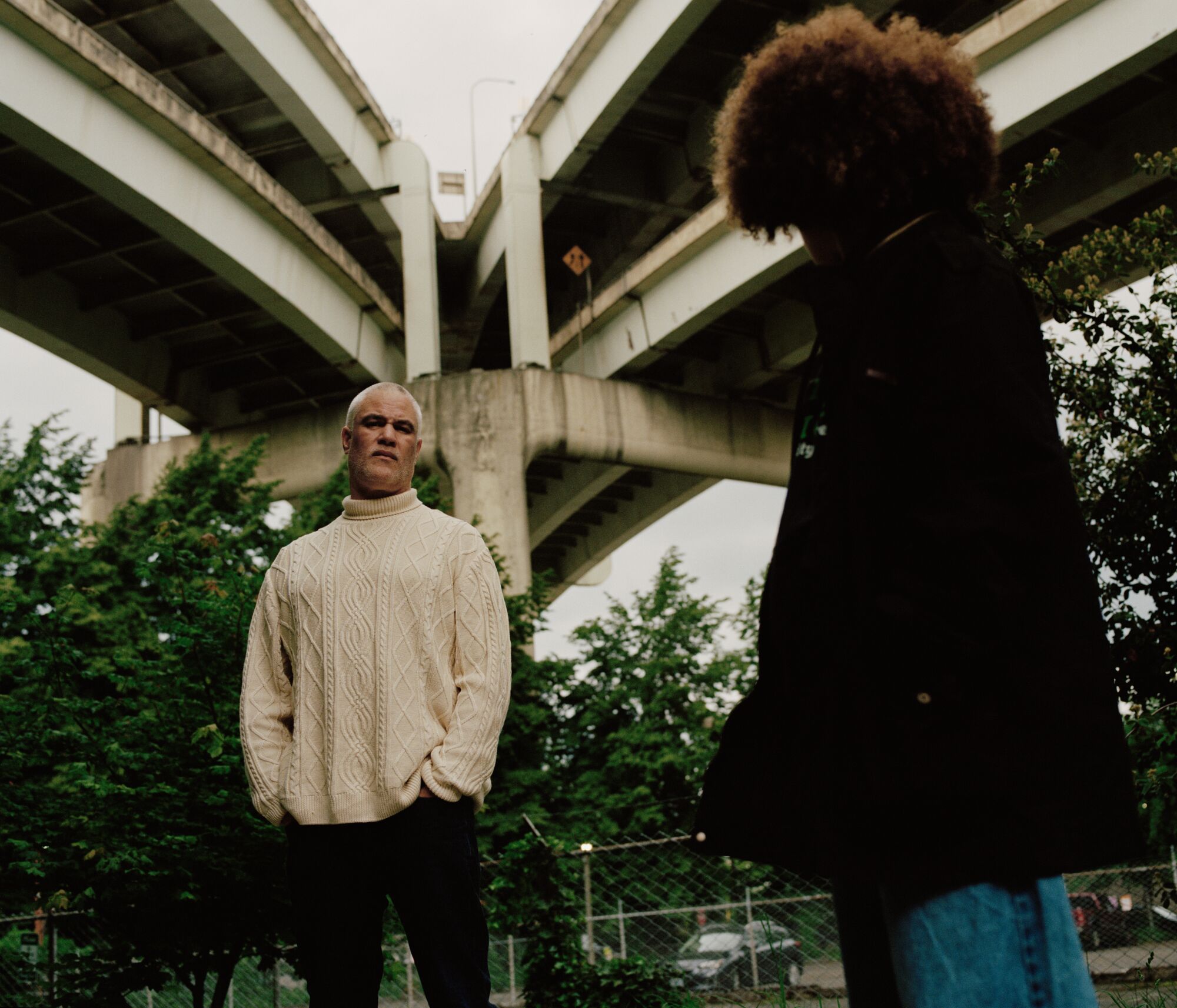 Mat Johnson with his teenage daughter, her face turned from the camera, outdoors.