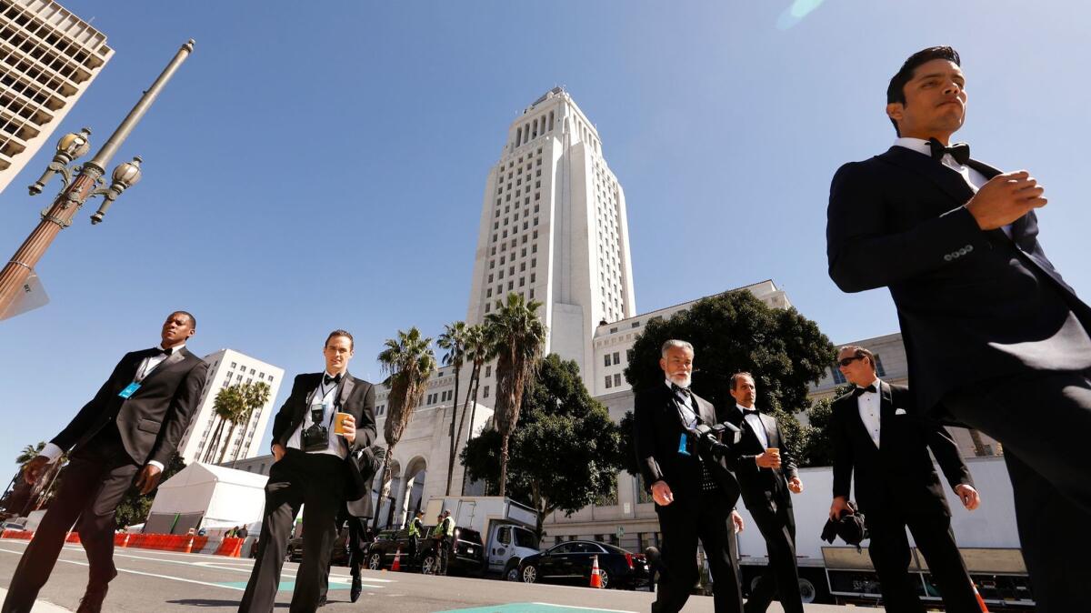 Actors cross Spring Street in downtown Los Angeles during the filming of "Ocean's Eight" in March. (Al Seib / Los Angeles Times)