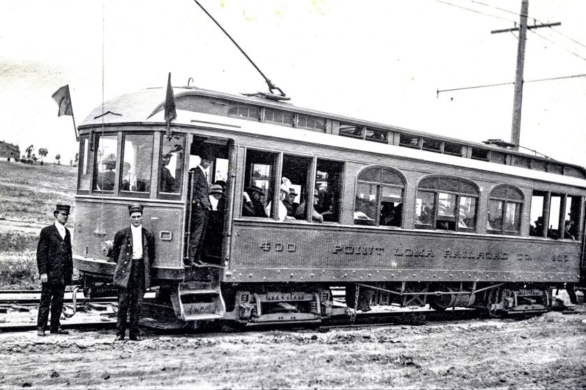 Point Loma Railroad car No. 400, headed west along Wabaska Drive, pauses on the way to Wonderland in Ocean Beach.