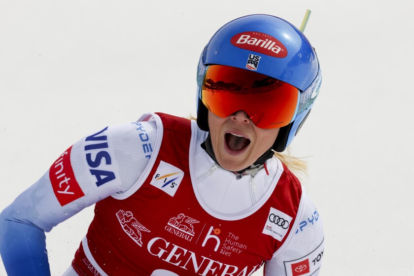 United States' Mikaela Shiffrin reacts in the finish area of an alpine ski, women's World Cup Finals downhill, in Courchevel, France, Wednesday, March 16, 2022. (AP Photo/Alessandro Trovati)